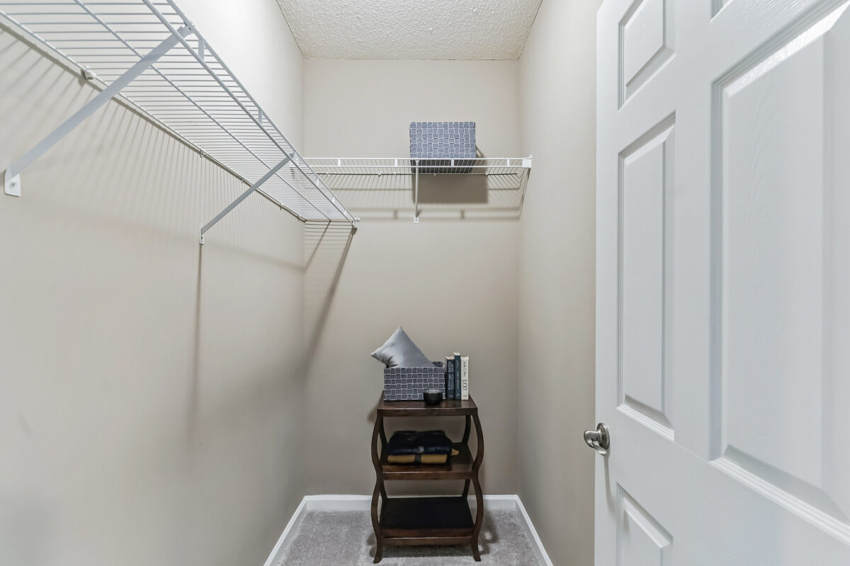 Empty closet with bedside table