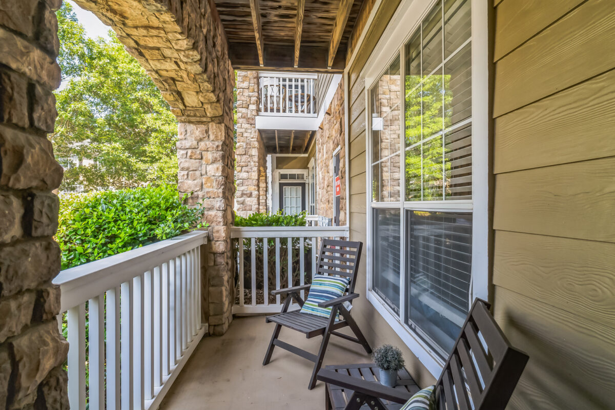 Balcony with chairs and colorful pillows