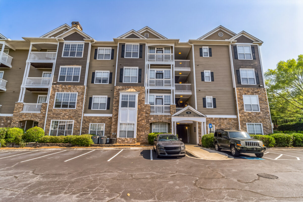 wide angle shot of apartments and parking lot